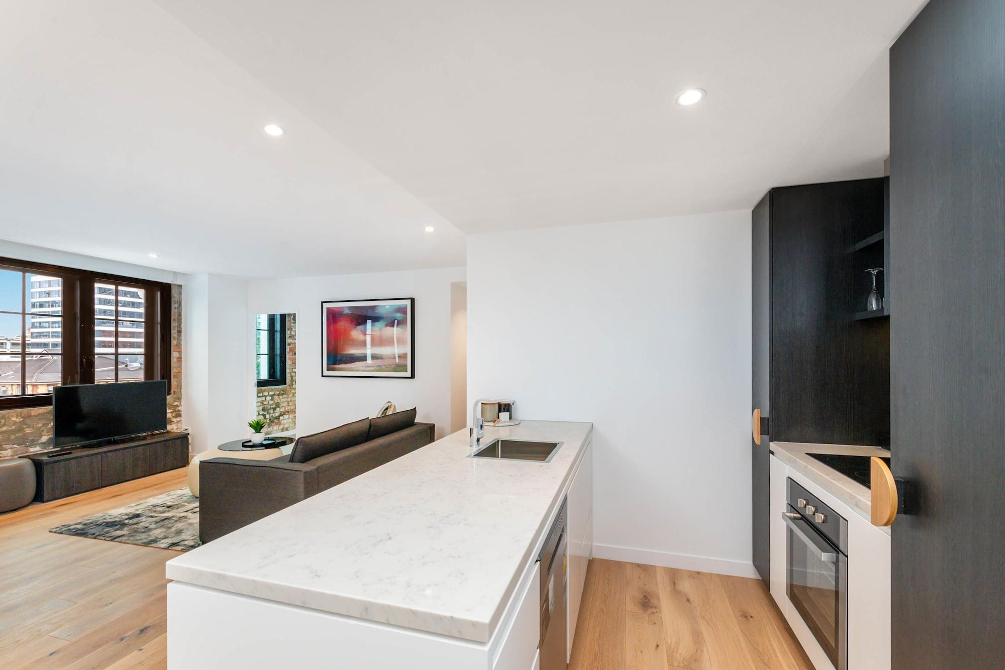 Fv By Peppers Aparthotel Brisbane Kültér fotó The kitchen and living area of a typical apartment